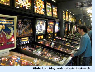 man playing pinball