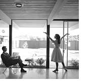 image of woman in front of windows