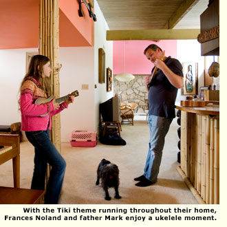 father and daughter play ukelele