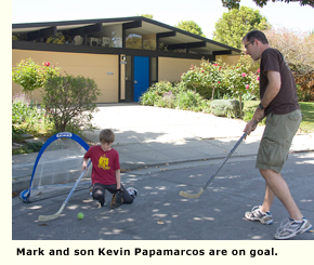 dad and son playing on street
