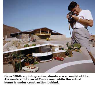 photographer shooting a model of the house of tomorrow
