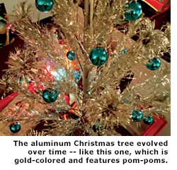 gold xmas tree with pom poms