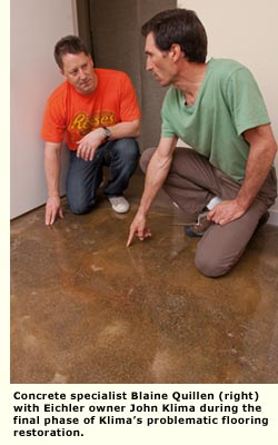 two men inspecting concrete  floor