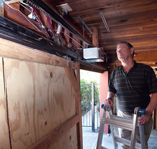 Ed Chamberlain with his do-it-yourself automated doors.