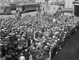 Here, in May 1934, a crowd of longshoremen rallies during the strike.