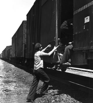 After the Depression, San Jule was one of the thousands of teen hoboes, like the ones pictured here, who hopped trains around the country. 