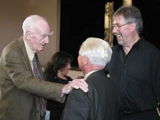 After 50 years apart, San Jule (left) was reunited with Matt Kahn (center), Eichler Homes original interior designer, at the Celebrate Eichlers event in Palo Alto, 2002. San Jule was a guest speaker. A smiling Eichler Network director Marty Arbunich (right) looks on. Five months later, San Jule passed away at age 89.