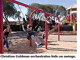 residents on swings in park