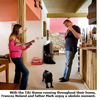 father and daughter play ukelele